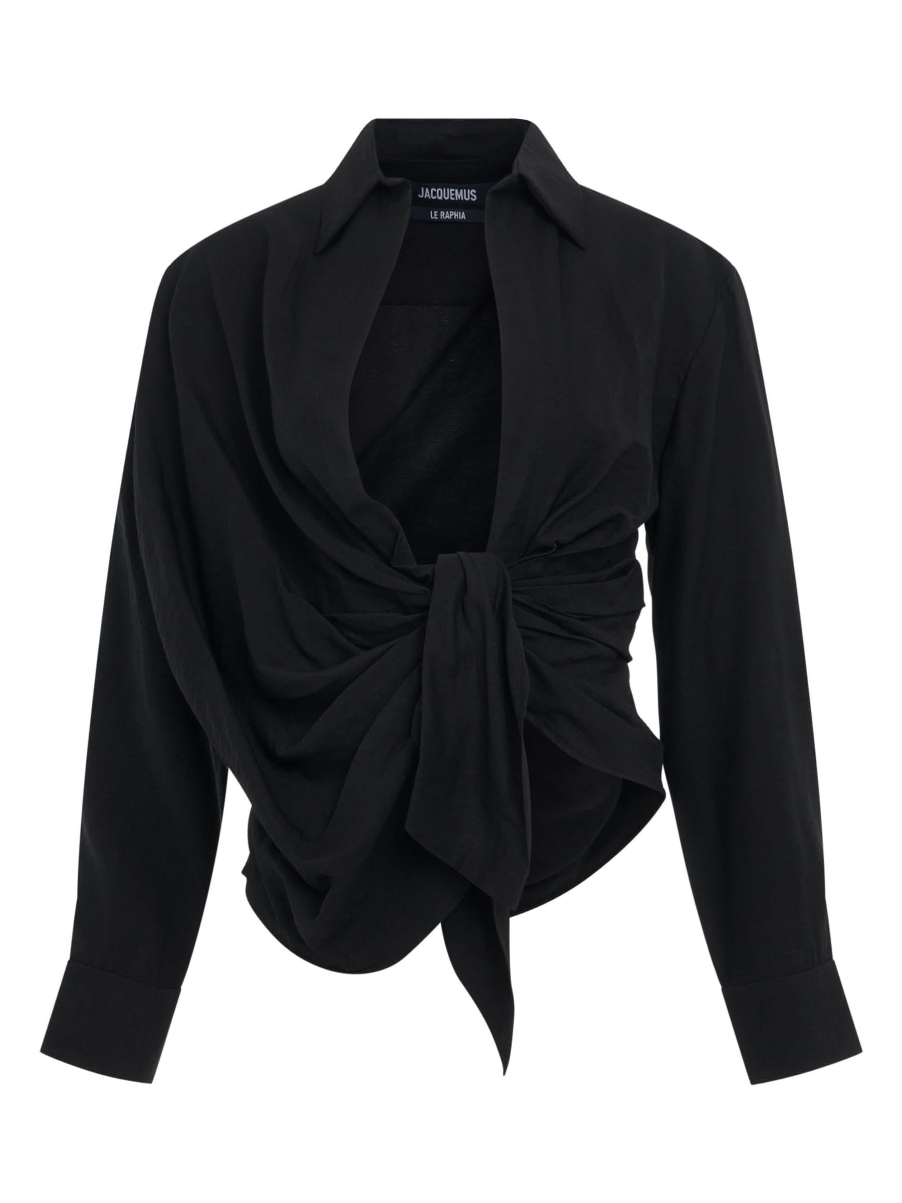 Image of a model wearing Tops. Productname: JACQUEMUS Bahia Tied Sash Shirt in Black colour by brand - JACQUEMUS