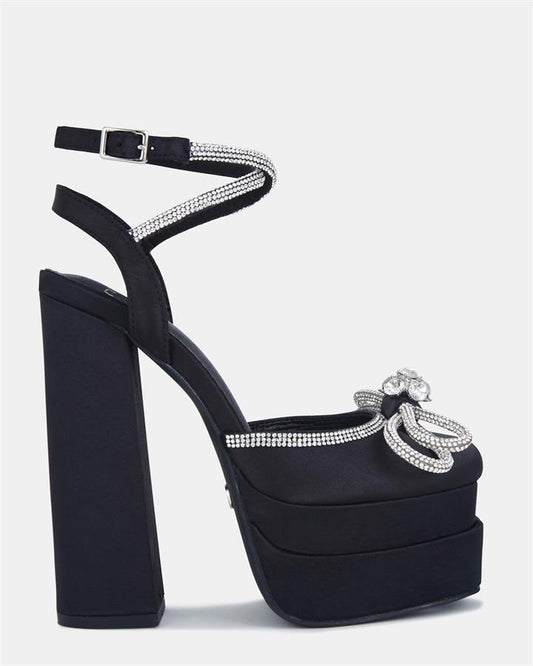 Image of Sandals. Product name - Zamari Women's Fast Fashion Black Satin Novo Sandals in Black Satin colour by brand - NOVO
