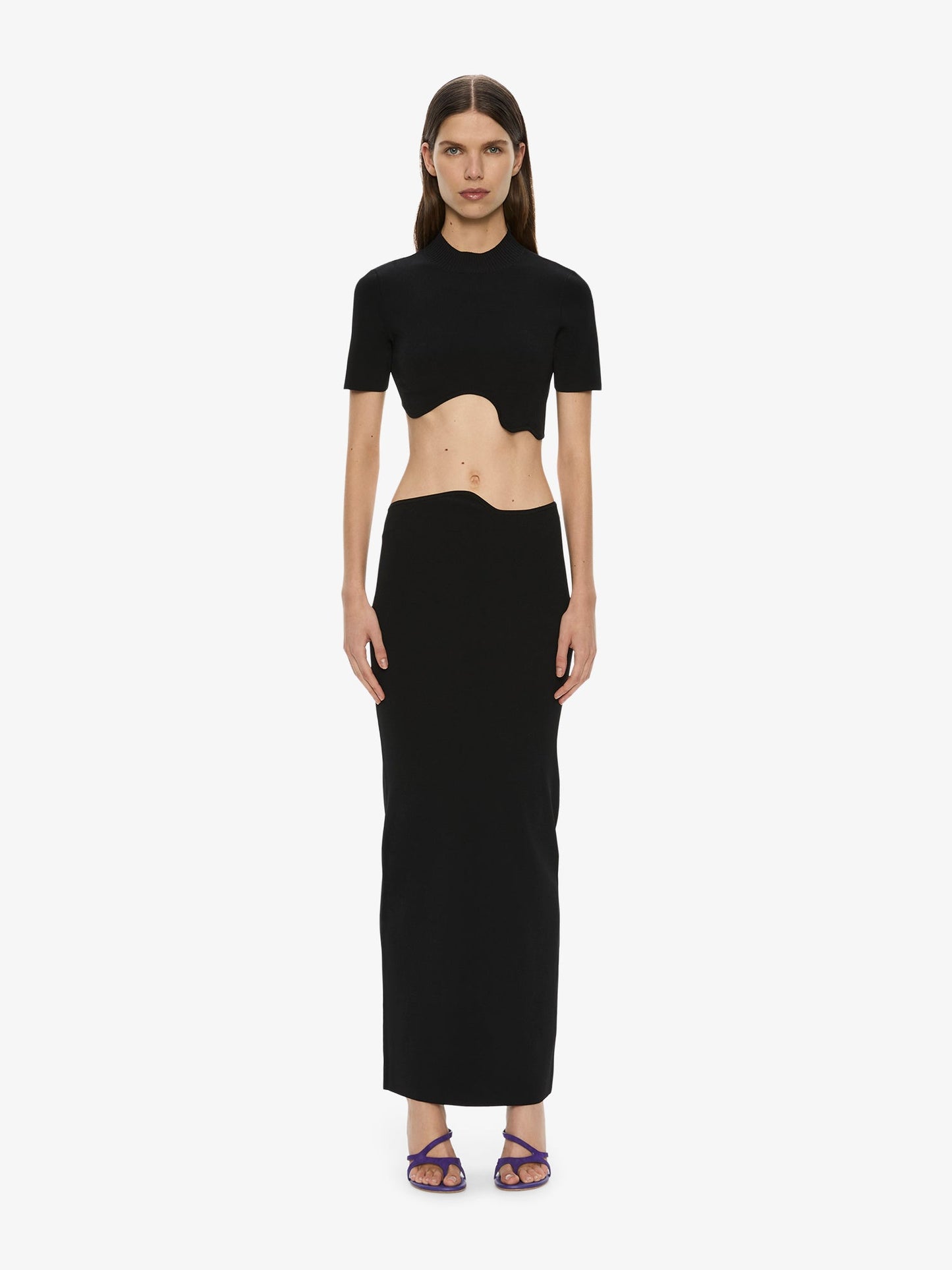 Image of a model wearing Skirts. Productname: CHRISTOPHER ESBER Maparadita Midi Skirt in Black colour by brand - CHRISTOPHER ESBER