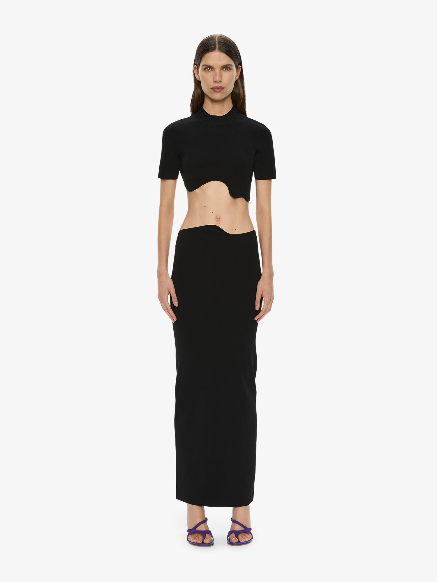 Image of a model wearing Skirts. Productname: CHRISTOPHER ESBER Maparadita Midi Skirt in Black colour by brand - CHRISTOPHER ESBER