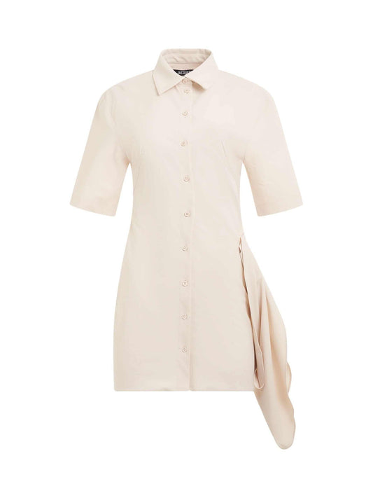 Image of a model wearing Dress. Productname: JACQUEMUS Camisa Dress in Ivory colour by brand - JACQUEMUS