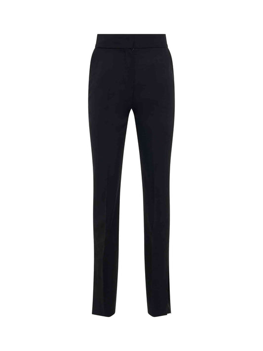 Image of a model wearing Pants. Productname: JACQUEMUS Tibau Flare Pants in Black colour by brand - JACQUEMUS