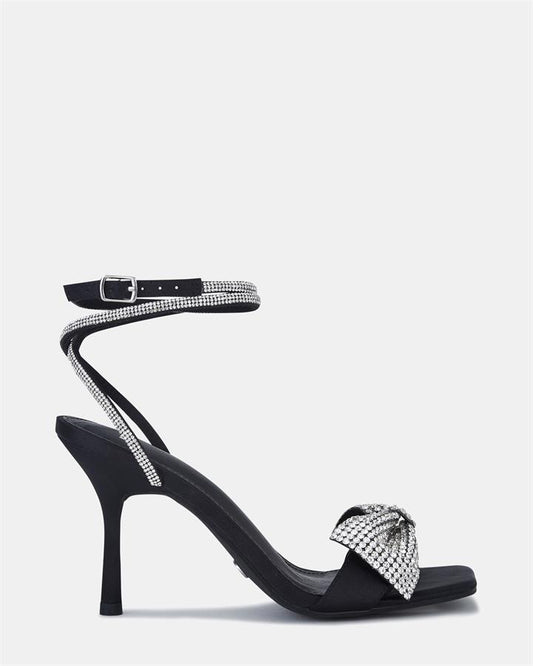 Image of Sandals. Product name - Yass Women's Fast Fashion Black Satin Novo Sandals in Black Satin colour by brand - NOVO