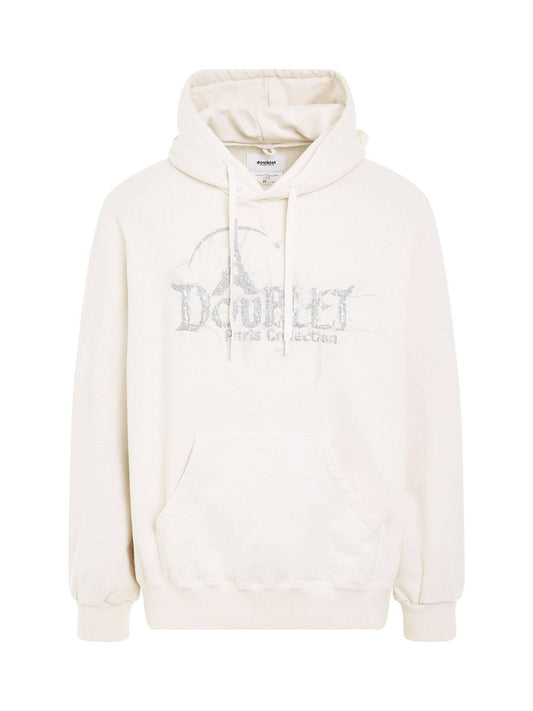 Image of a model wearing Outerwear. Productname: DOUBLET "DOUBLAND" Embroidery Hoodie in White colour by brand - DOUBLET