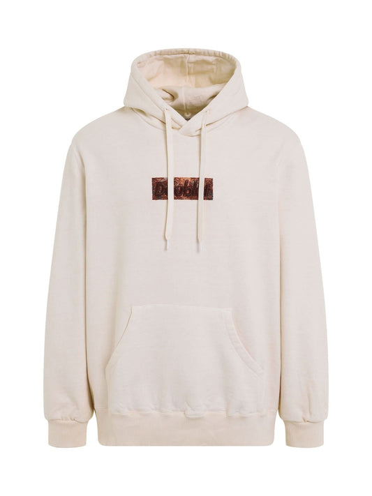 Image of a model wearing Outerwear. Productname: DOUBLET Rust Embroidery Hoodie in WHITE colour by brand - DOUBLET