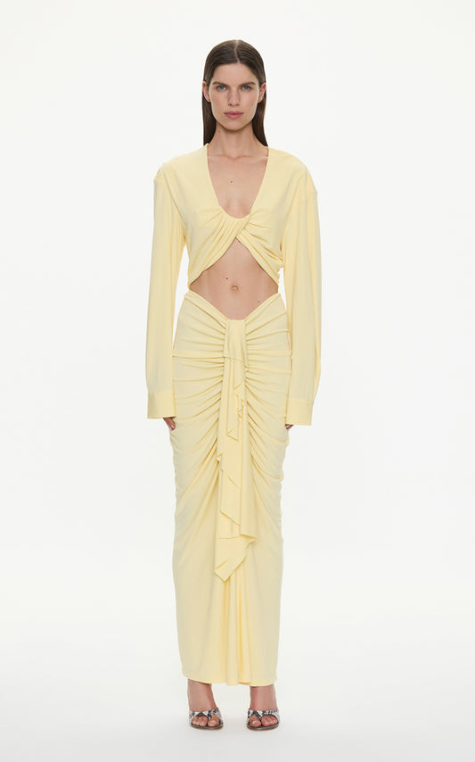 Image of a model wearing Tops. Product name - Vivenda Drape Long Sleeve Top in Butter colour by brand - CHRISTOPHER ESBER
