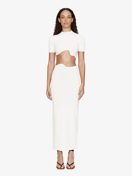 Image of a model wearing Skirts. Product name - Maparadita Midi Skirt in White colour by brand - CHRISTOPHER ESBER
