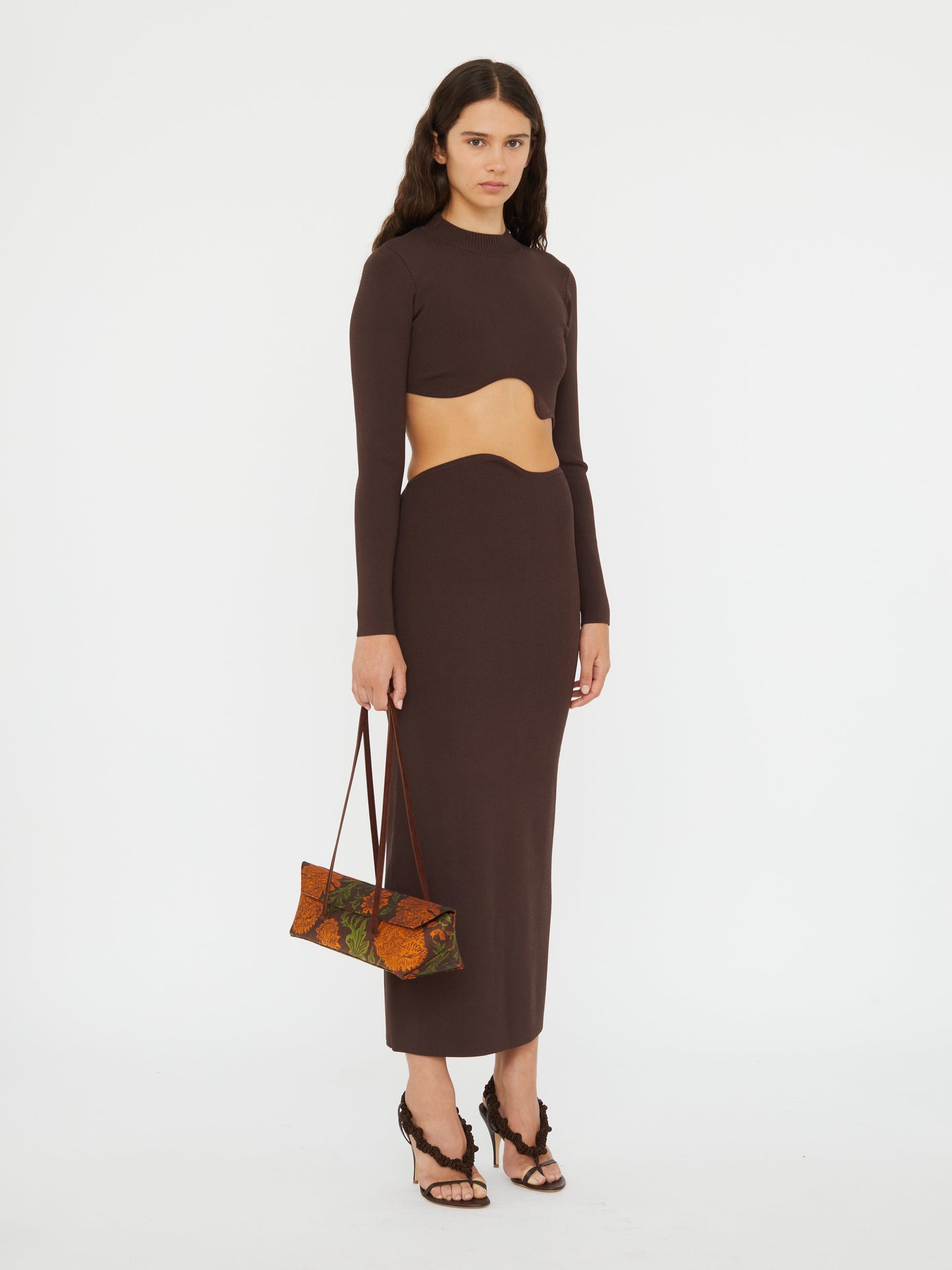 Image of a model wearing Skirts. Productname: CHRISTOPHER ESBER Maparadita Midi Skirt in Espresso colour by brand - CHRISTOPHER ESBER