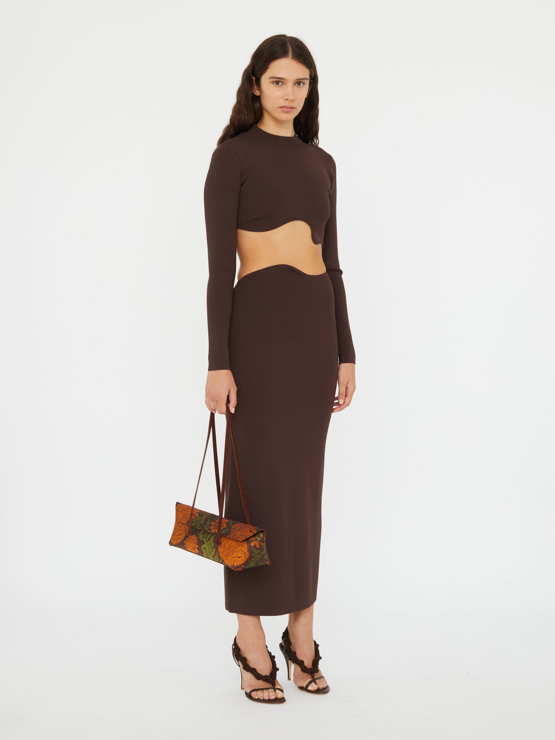Image of a model wearing Skirts. Productname: CHRISTOPHER ESBER Maparadita Midi Skirt in Espresso colour by brand - CHRISTOPHER ESBER