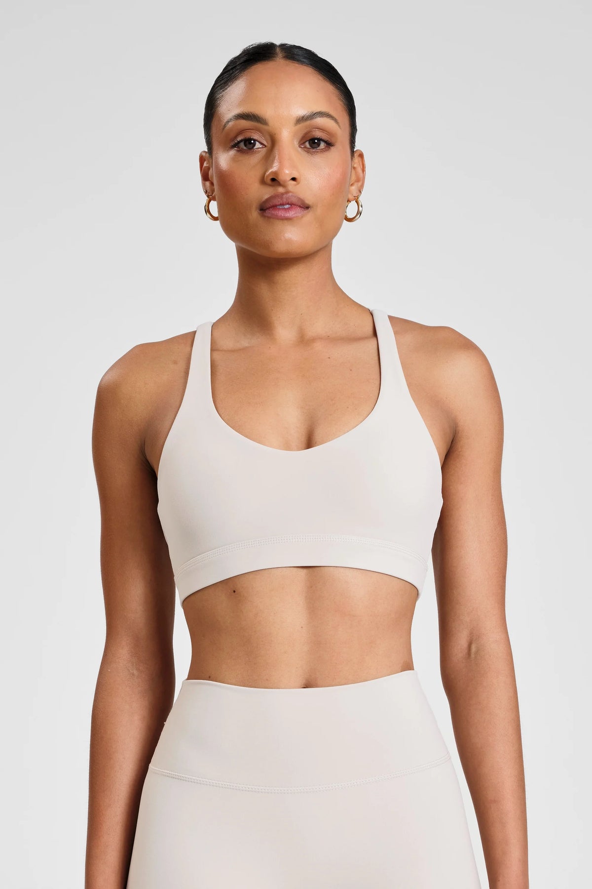 Image of Activewear. Product name - ALLFENIX CloudCore Cross Back Sports Bra in Stone colour by brand - All Fenix