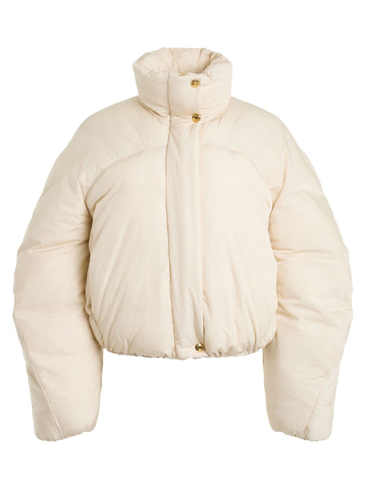 Image of a model wearing Outerwear. Productname: JACQUEMUS La Doudoune Courte Caraco Jacket in Off White colour by brand - JACQUEMUS