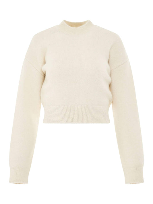 Image of a model wearing Outerwear. Productname: JACQUEMUS La Maille Jacquemus Sweater in Light Beige colour by brand - JACQUEMUS