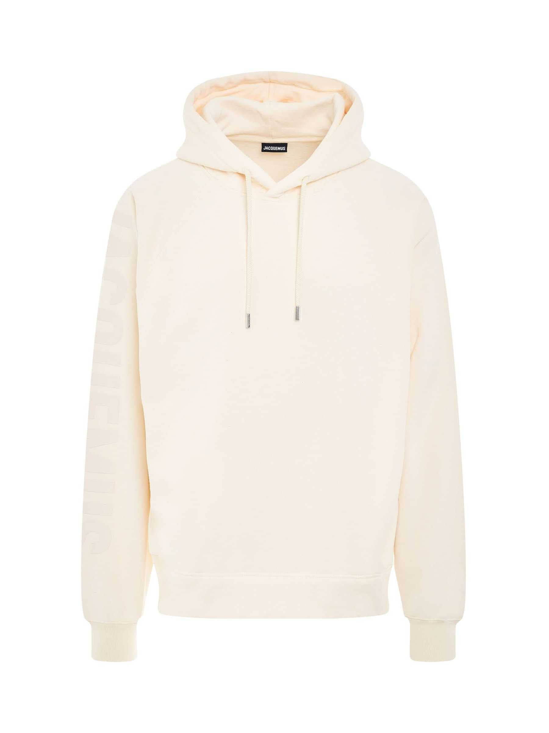 Image of a model wearing Outerwear. Productname: JACQUEMUS Typo Logo Hoodie in BEIGE colour by brand - JACQUEMUS