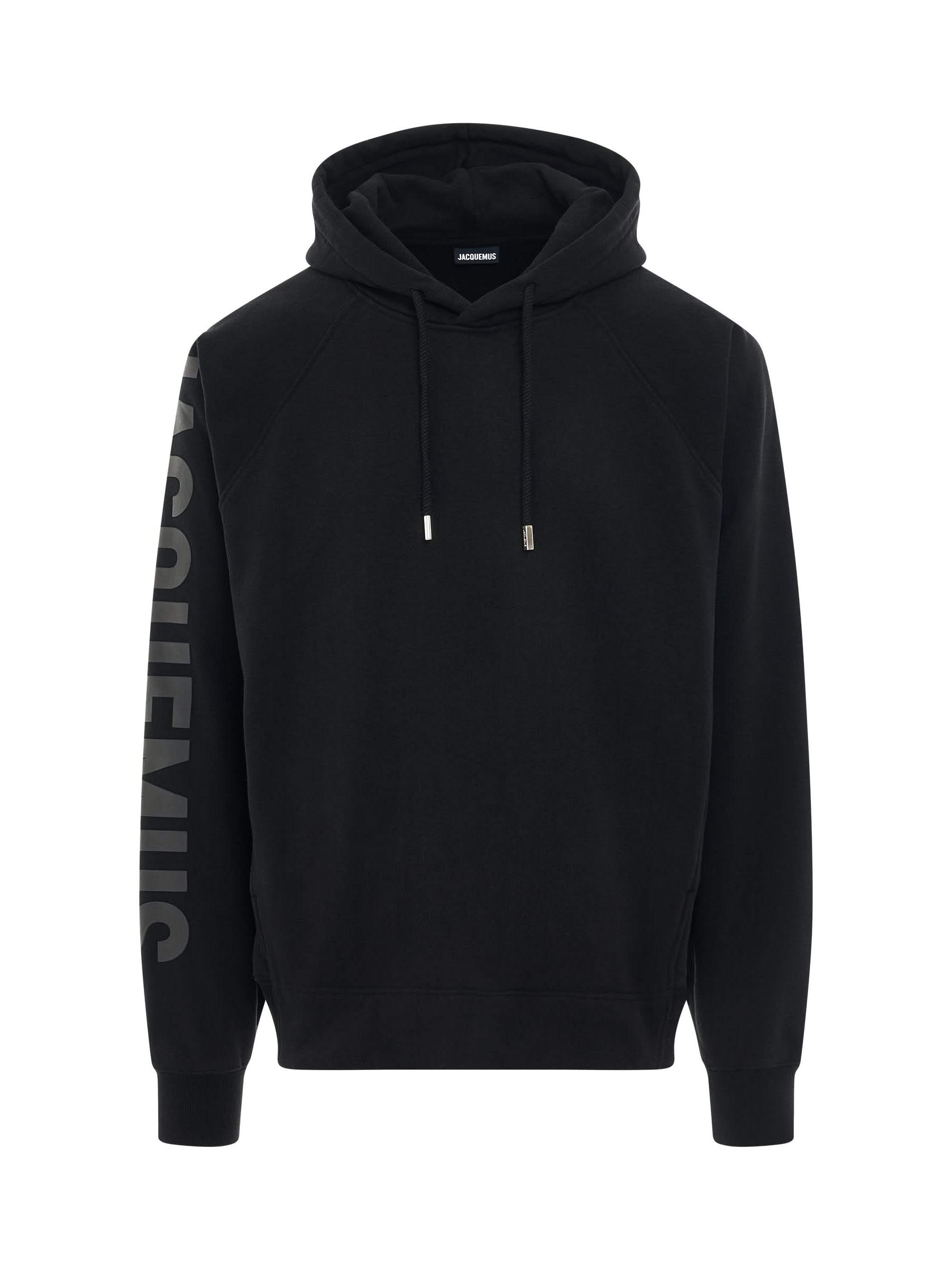 Image of a model wearing Outerwear. Productname: JACQUEMUS Typo Logo Hoodie in BLACK colour by brand - JACQUEMUS