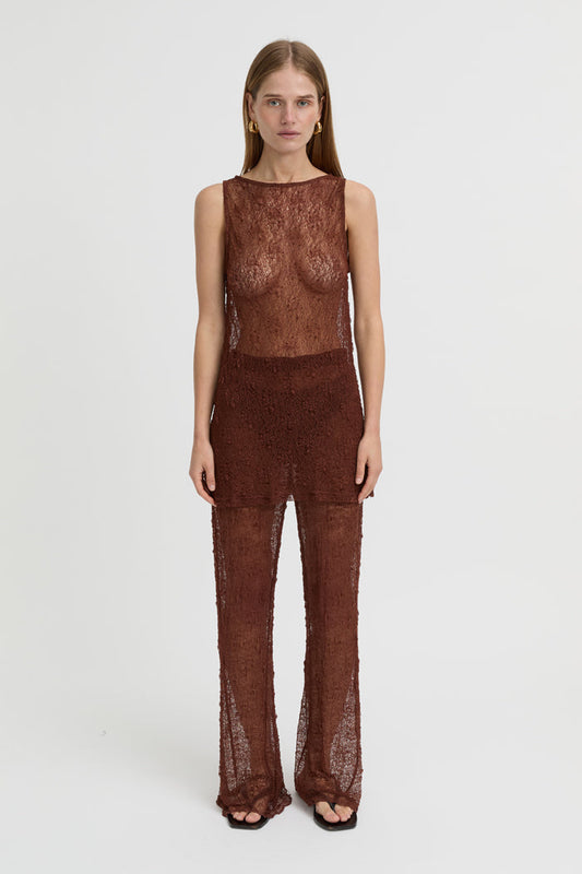 Image of a model wearing Tops. Product name - Riven Tank Brown in Brown colour by brand - Blanca Studio