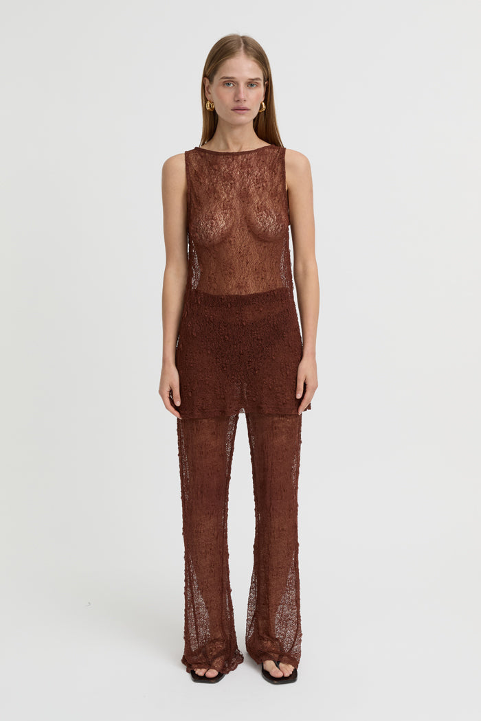 Image of a model wearing Pants. Product name - Riven Pants Brown in Brown colour by brand - Blanca Studio
