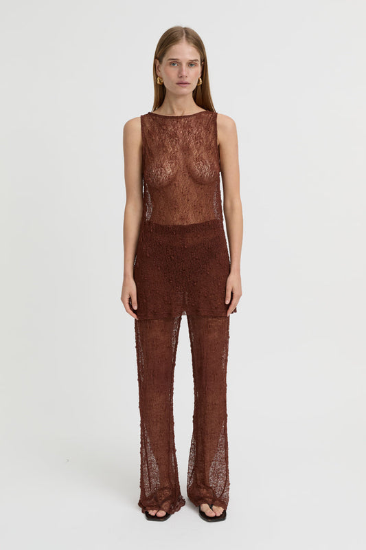 Image of a model wearing Pants. Product name - Riven Pants Brown in Brown colour by brand - Blanca Studio