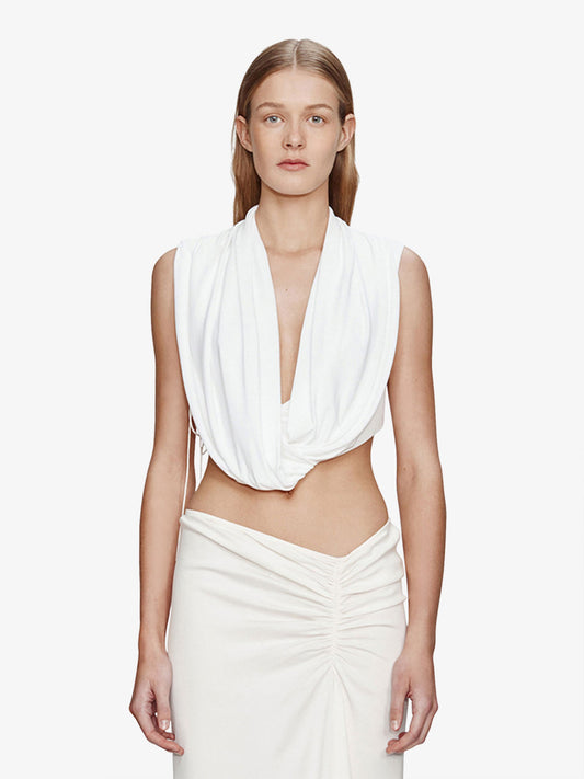 Image of a model wearing Tops. Product name - Interlock Jersey Drape Top in White colour by brand - CHRISTOPHER ESBER