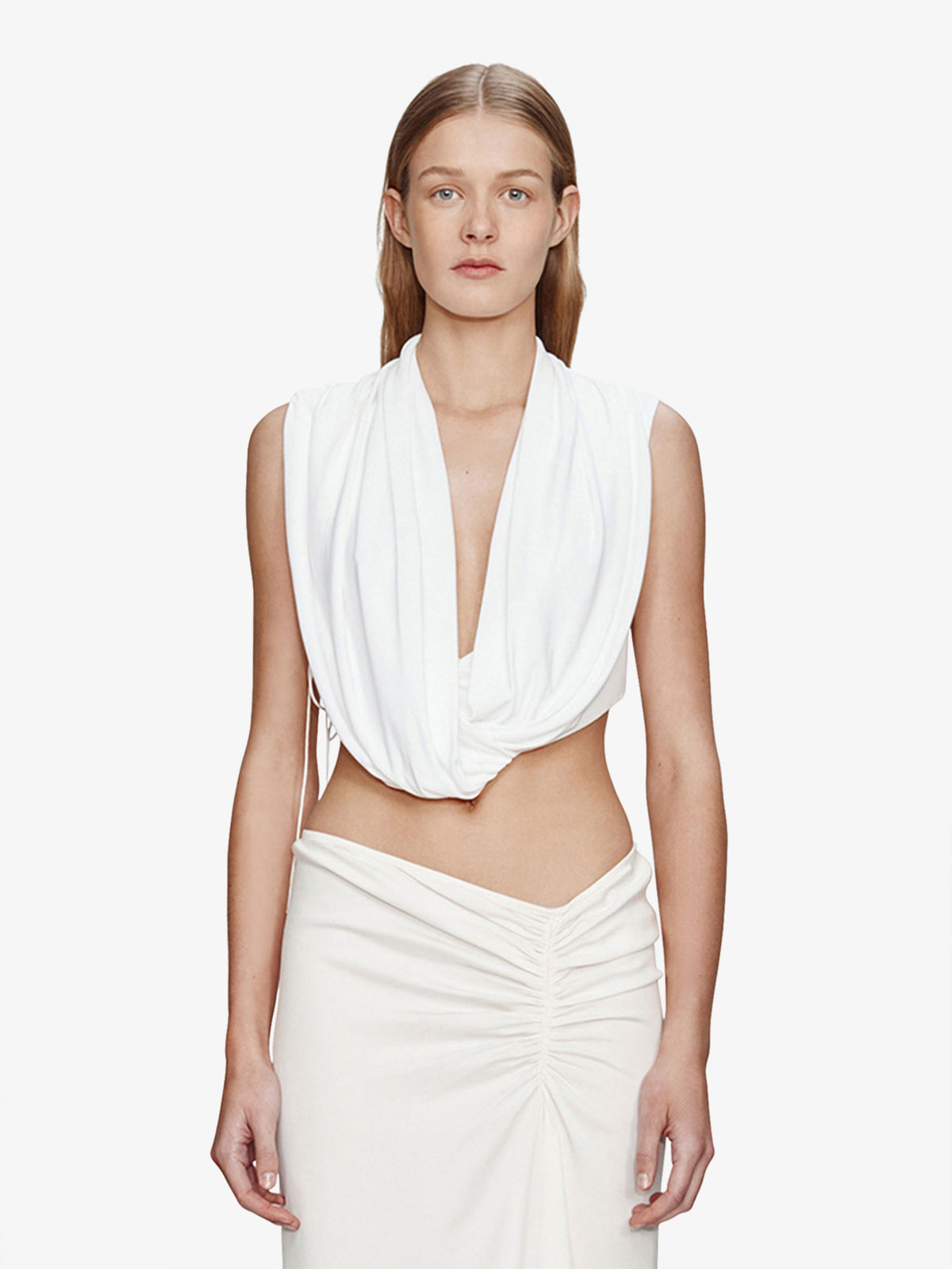 Image of a model wearing Tops. Product name - Interlock Jersey Drape Top in White colour by brand - CHRISTOPHER ESBER