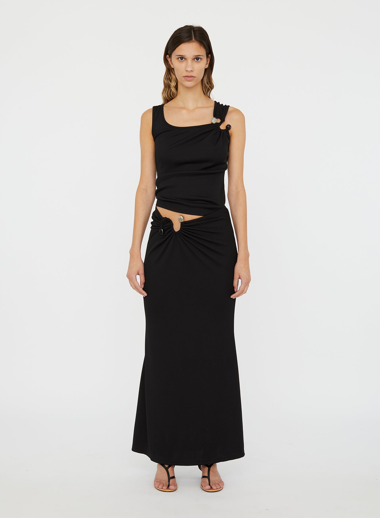Image of a model wearing Skirts. Productname: Christopher Esber S-Buckle Suspension Skirt in Skirt colour by brand - Christopher Esber
