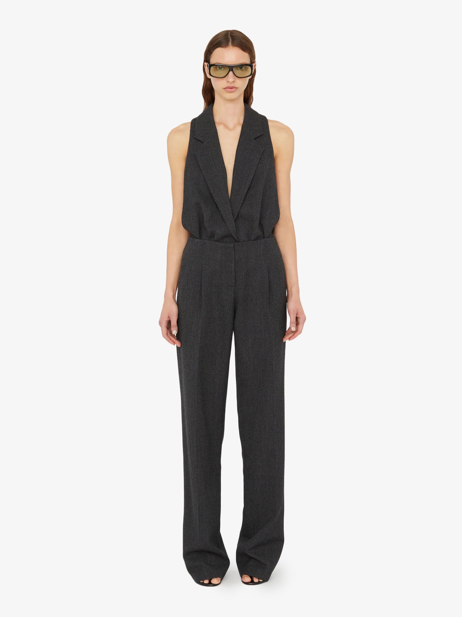 Image of a model wearing Pants. Product name - Redux Twill Trouser in Black colour by brand - Christopher Esber
