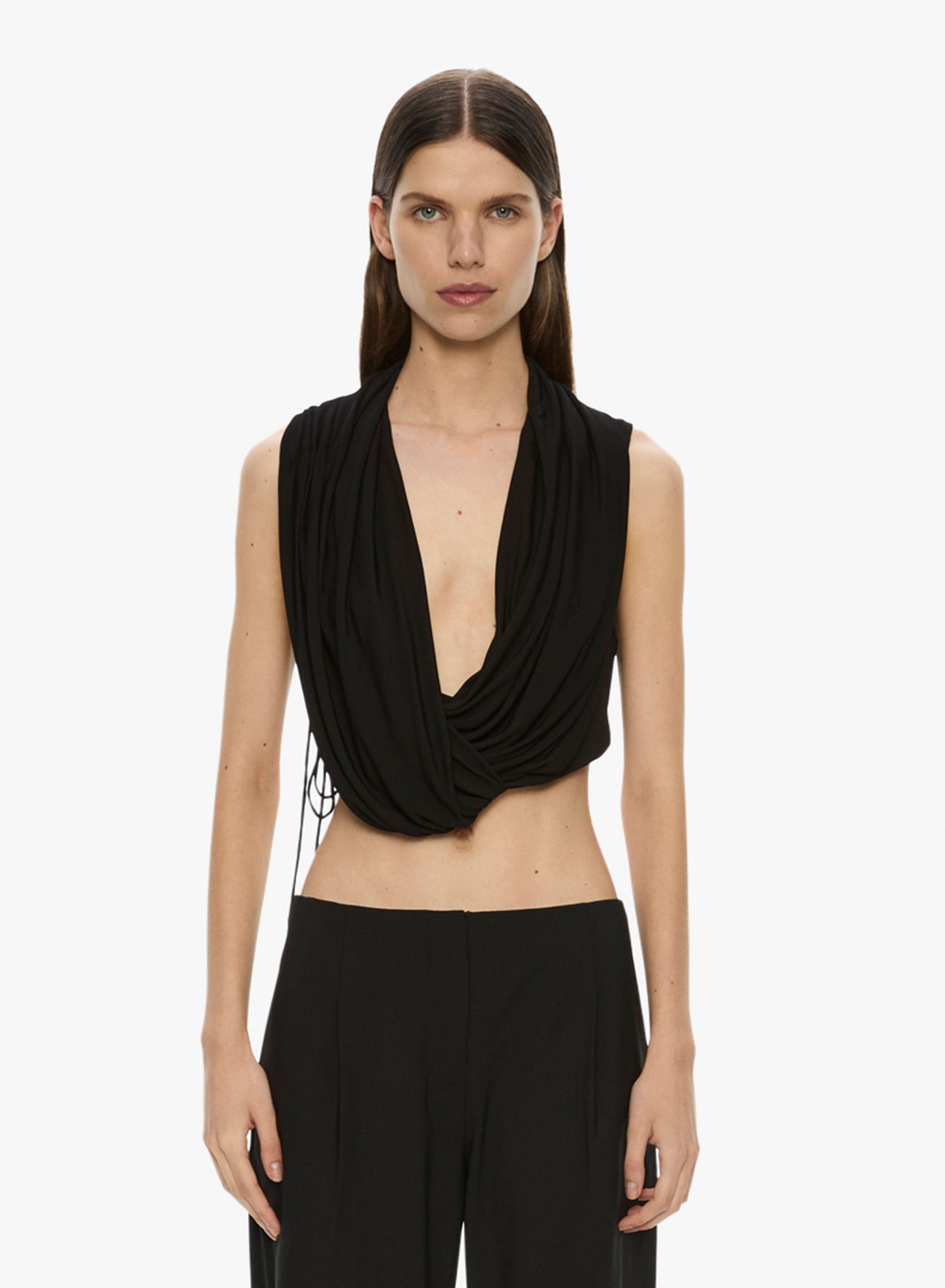 Image of a model wearing Tops. Productname: Christopher Esber Interlock Jersey Drape Top in Black colour by brand - Christopher Esber