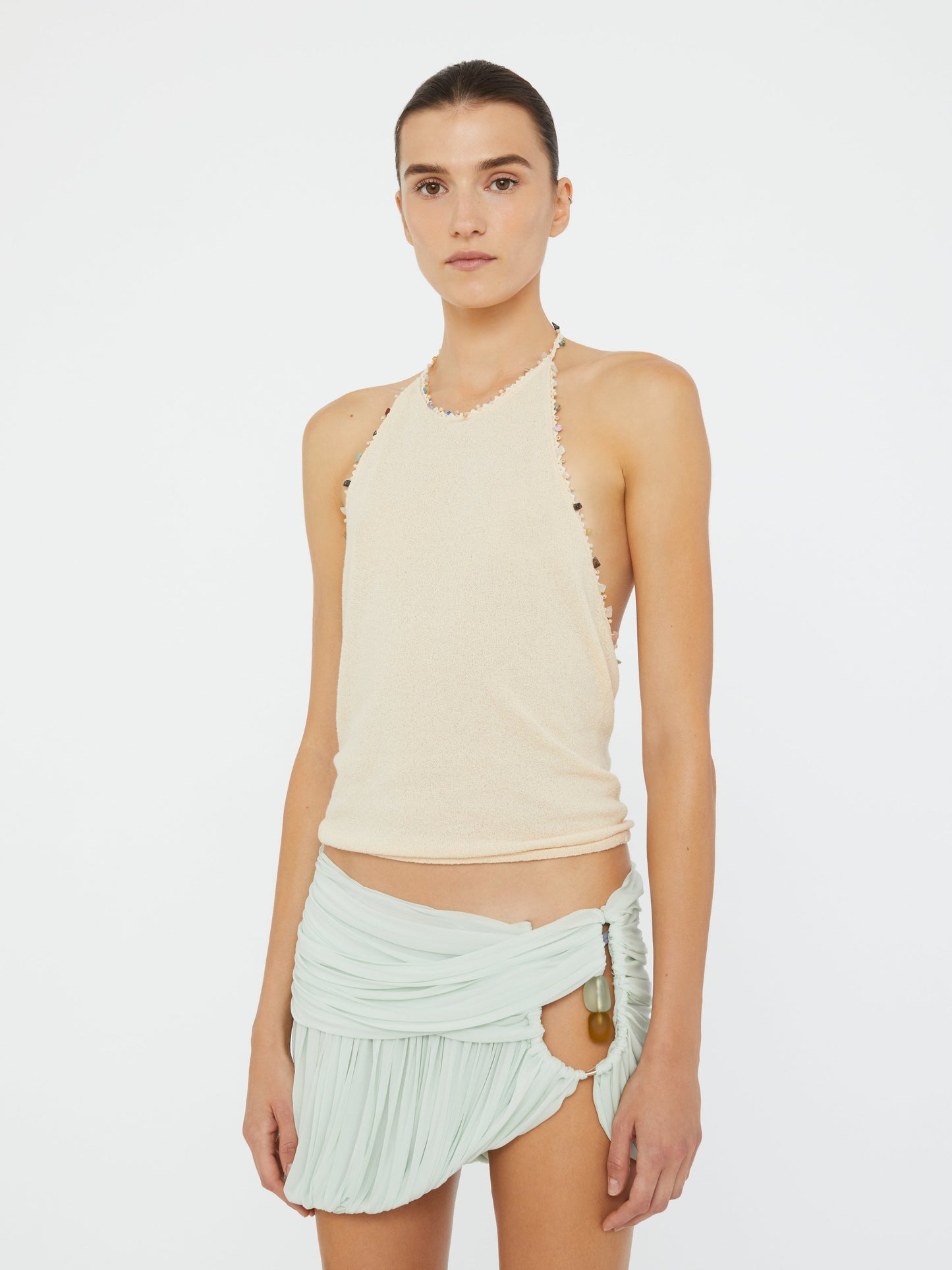 Image of a model wearing Tops. Productname: Christopher Esber Beach Quartz Halter Tank in Bone colour by brand - Christopher Esber