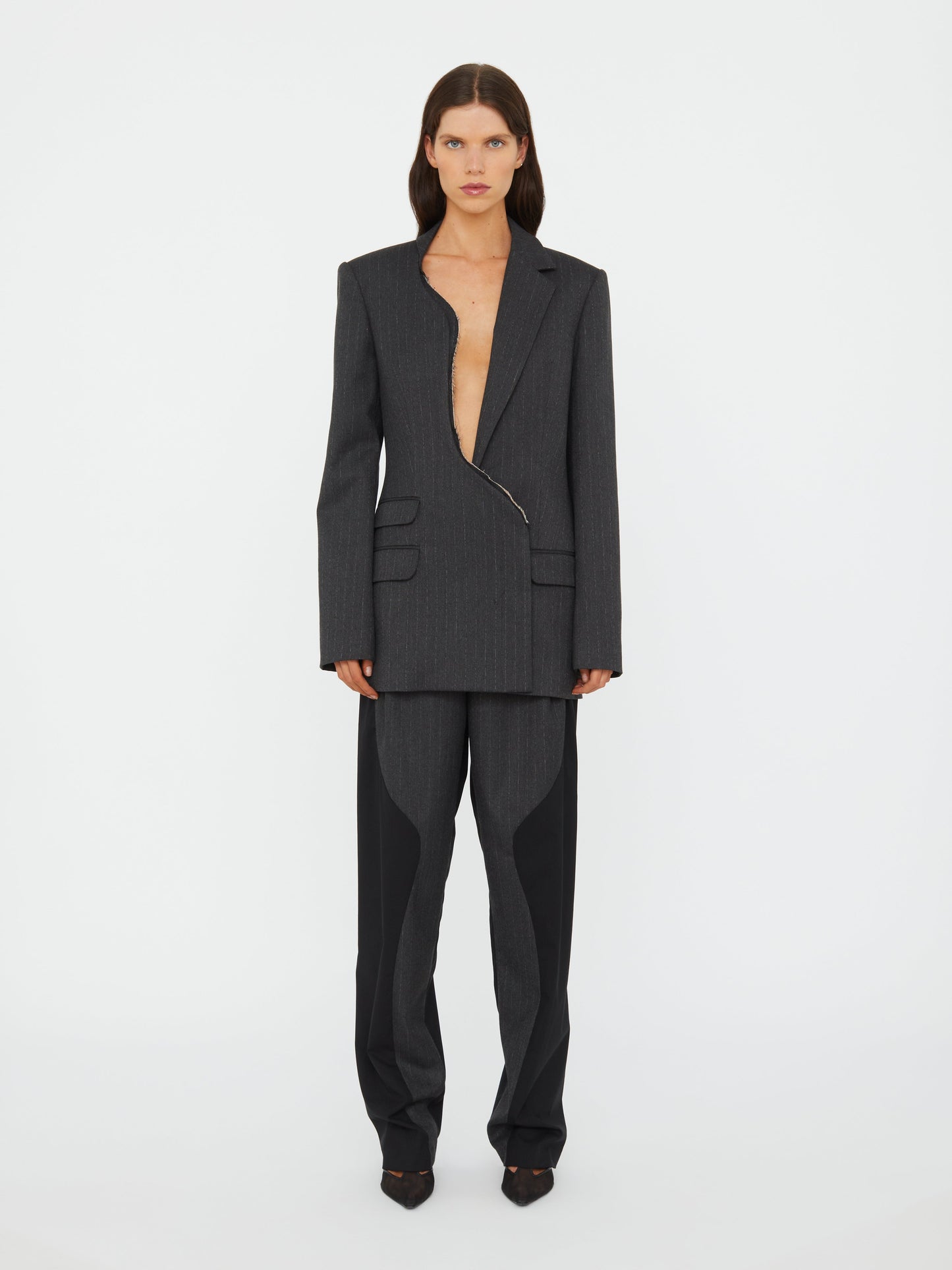 Image of a model wearing Outerwear. Productname: Christopher Esber Torrent Pinstripe Blazer in Stripe colour by brand - Christopher Esber