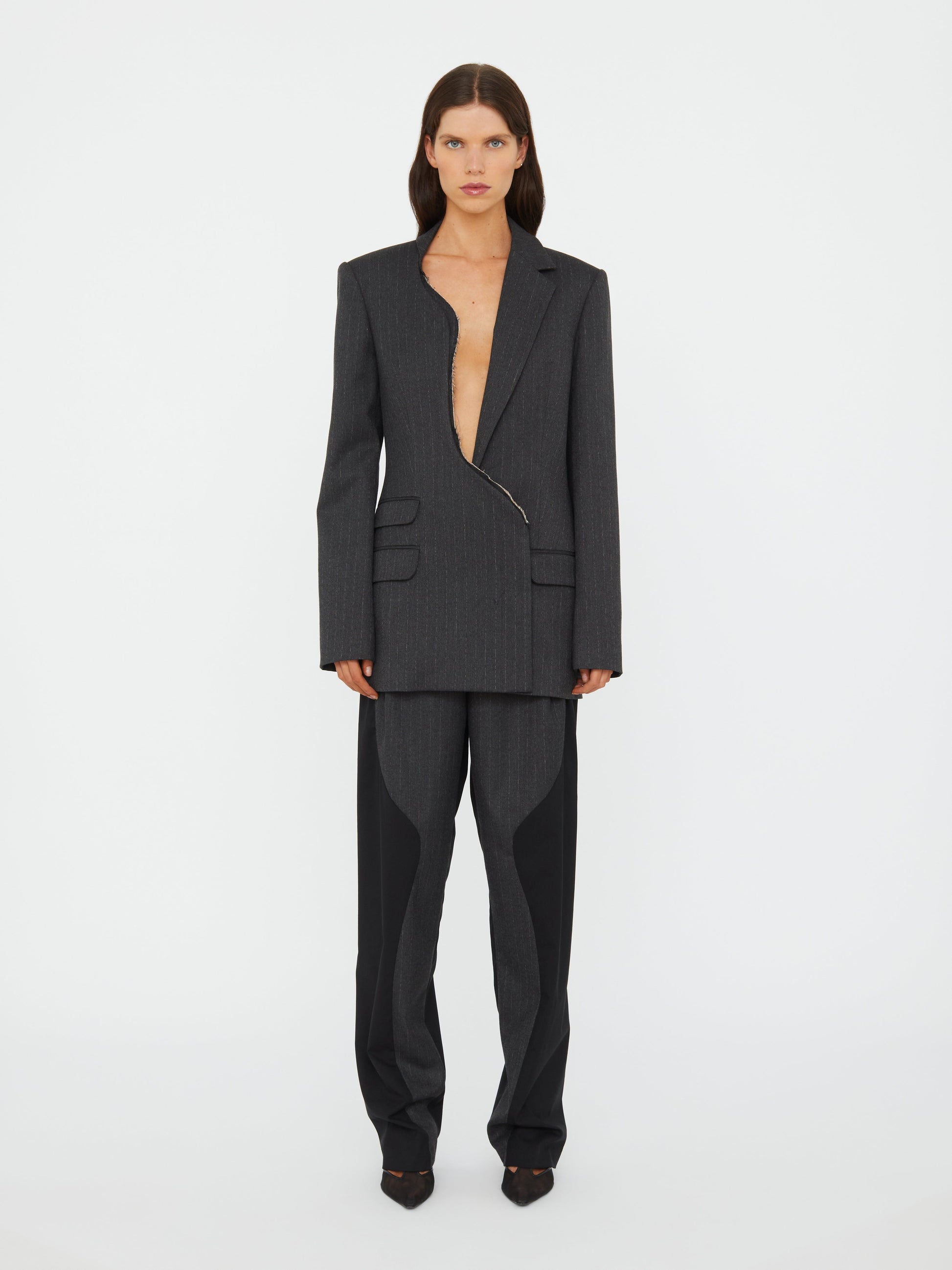 Image of a model wearing Outerwear. Productname: Christopher Esber Torrent Pinstripe Blazer in Stripe colour by brand - Christopher Esber
