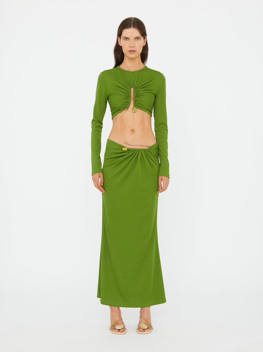 Image of a model wearing Skirts. Product name - Crystal Pin Rib Skirt in Cactus colour by brand - CHRISTOPHER ESBER