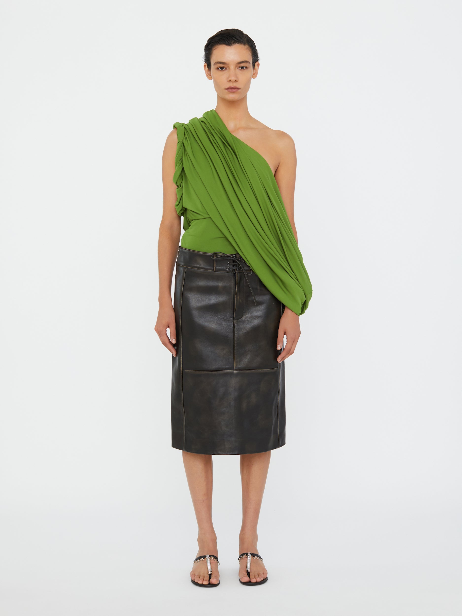 Image of a model wearing Skirts. Productname: Christopher Esber Burnished Eddie Leather Skirt in Skirt colour by brand - Christopher Esber