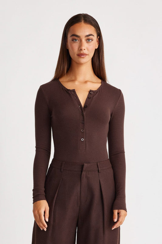 Image of a model wearing Tops. Productname: SNDYS HENLEY BODYSUIT in Chocolate colour by brand - SNDYS