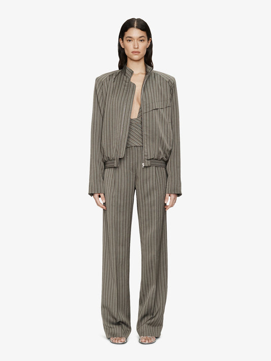 Image of a model wearing Pants. Product name - Reyer Tailored Redux Trouser in Stripe colour by brand - CHRISTOPHER ESBER