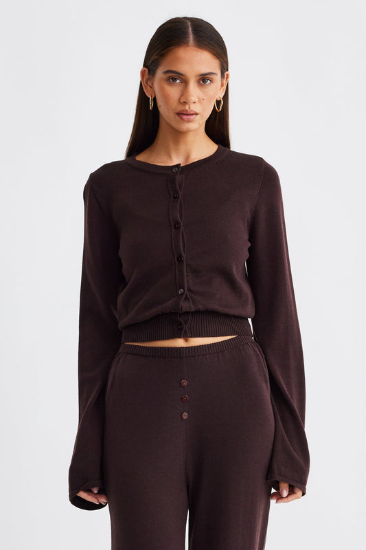 Image of a model wearing Outerwear. Productname: SNDYS AUGUST BUTTON UP TOP in Chocolate colour by brand - SNDYS