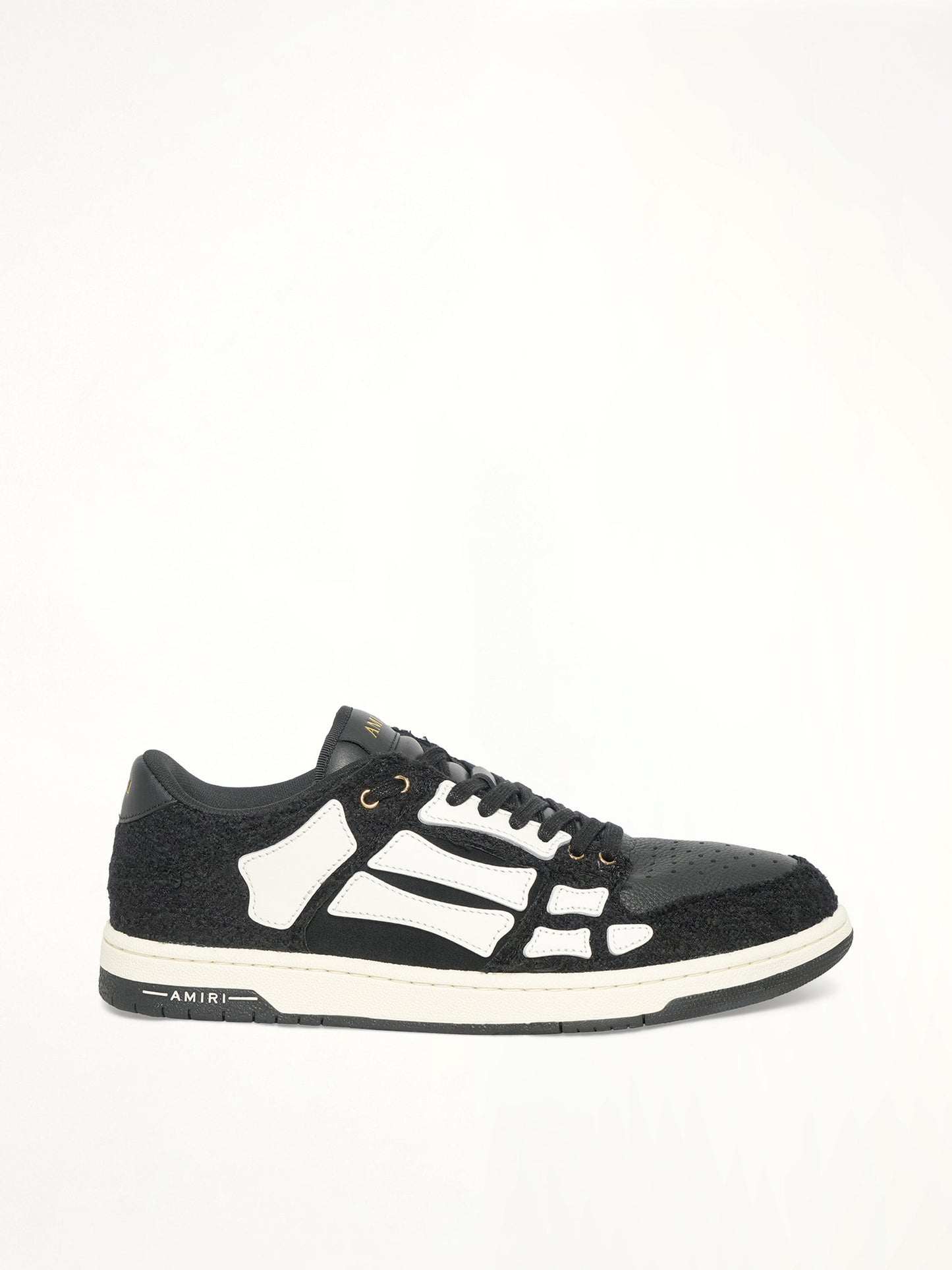 Image of Sneakers. Productname: AMIRI Boucle Skeleton Low Top Sneaker in Black colour by brand - AMIRI