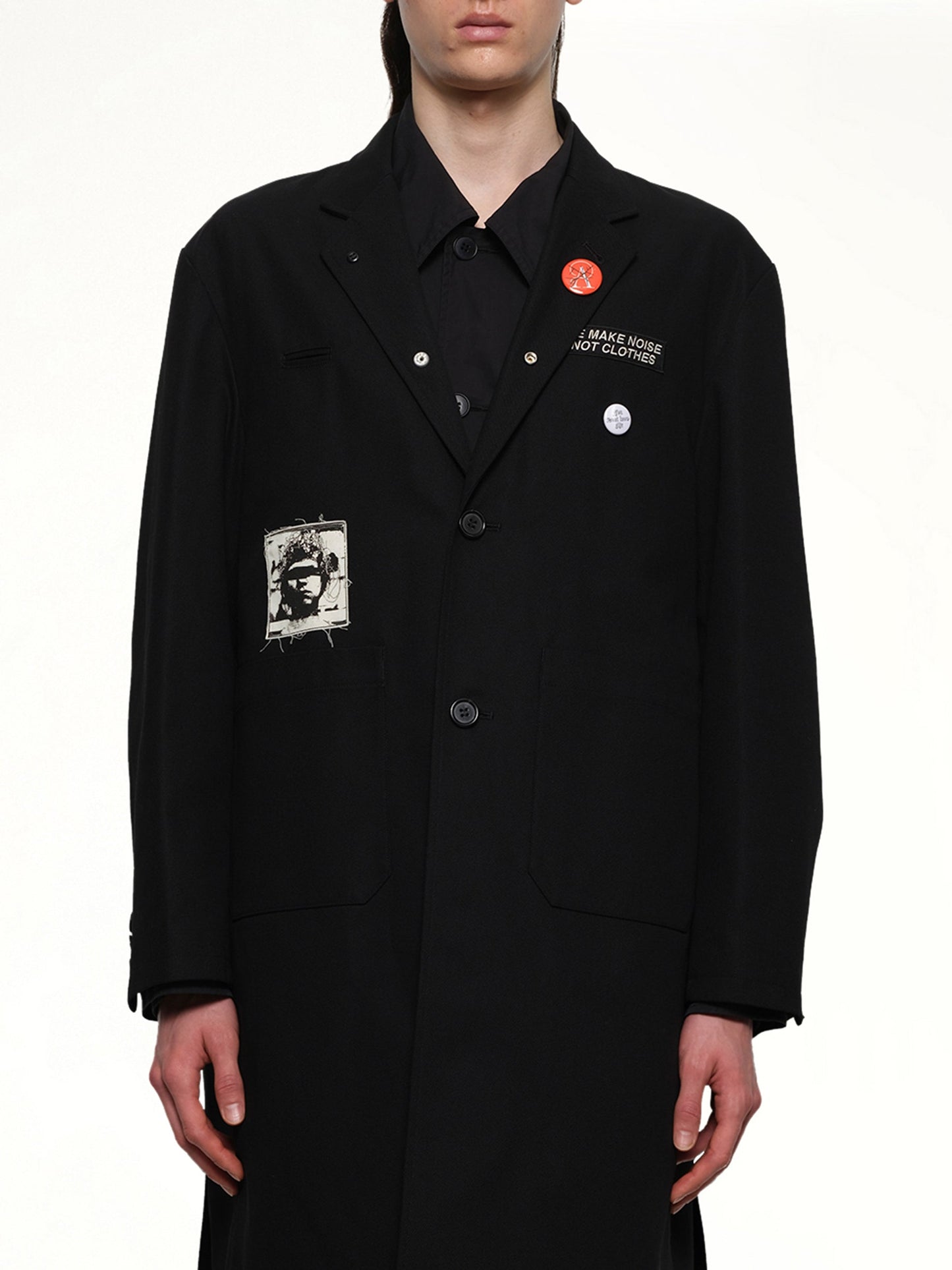 Image of a model wearing Outerwear. Product name - Undercover Coat in Black colour by brand - UNDERCOVER