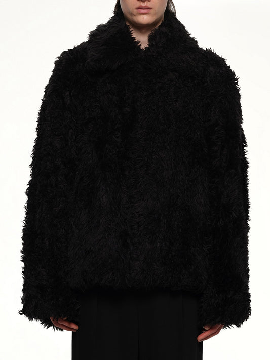 Image of a model wearing Outerwear. Productname: DOUBLET Sinister Mouth Faux Fur Jacket in BLACK colour by brand - DOUBLET