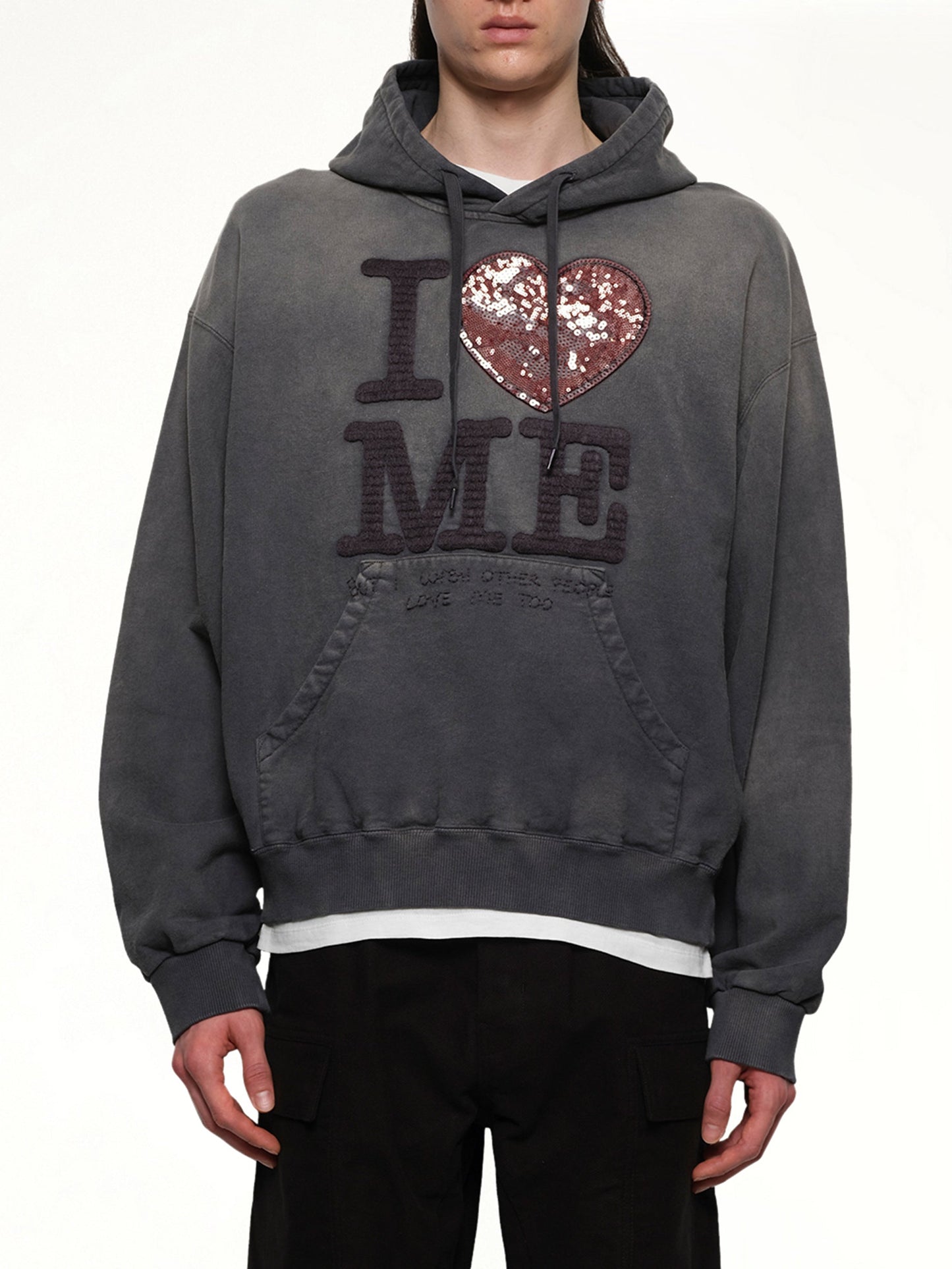 Image of a model wearing Outerwear. Productname: DOUBLET Grip-Love Hoodie in BLACK colour by brand - DOUBLET