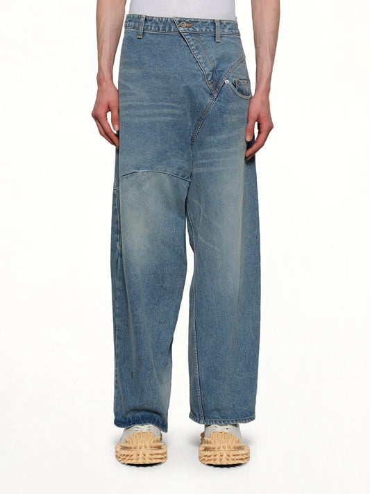 Image of a model wearing Denim. Productname: DOUBLET Distorted Cutting Denim Pants in INDIGO colour by brand - DOUBLET