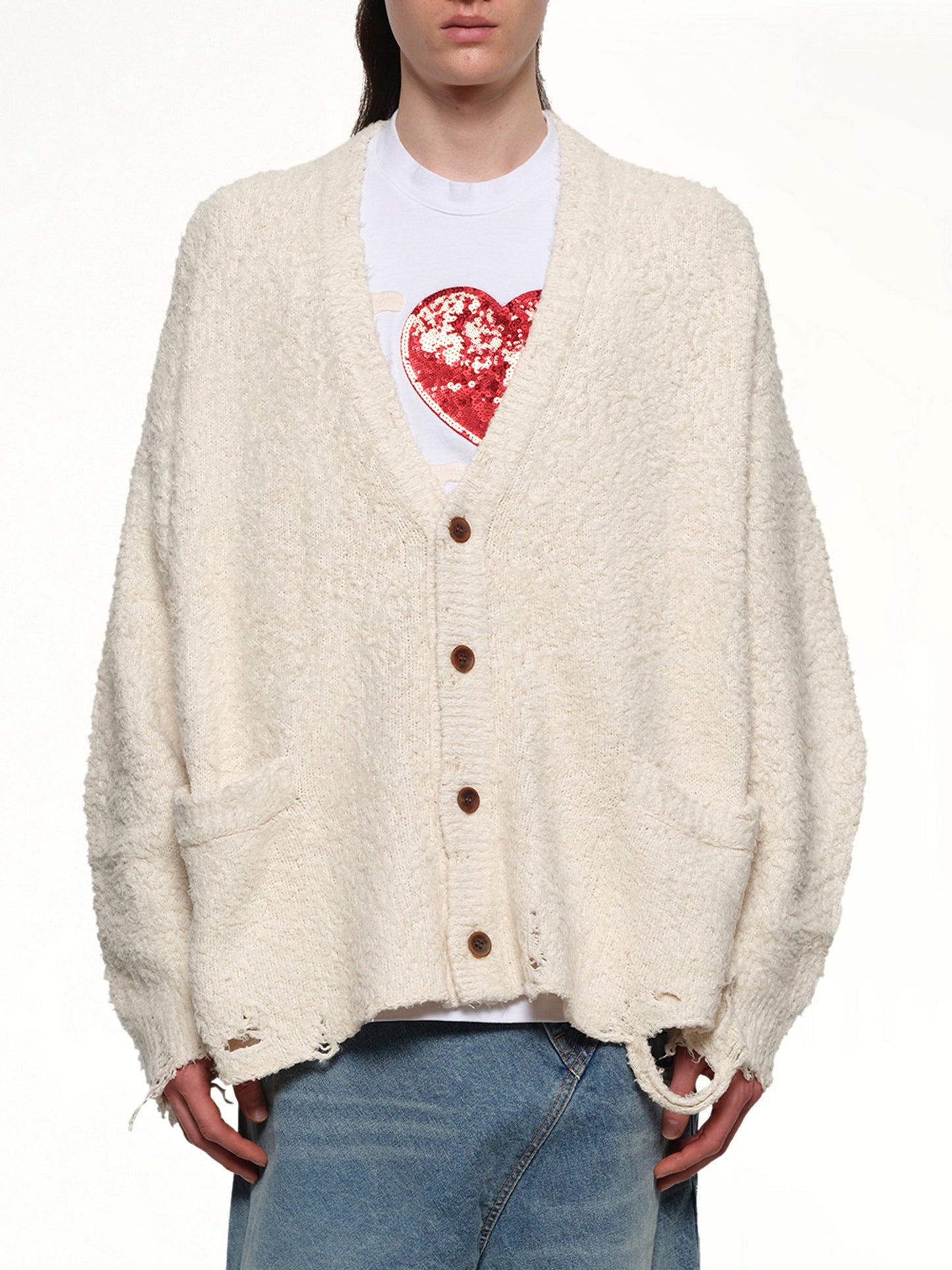 Image of a model wearing Outerwear. Productname: DOUBLET Backbone Knit Cardigan in IVORY colour by brand - DOUBLET