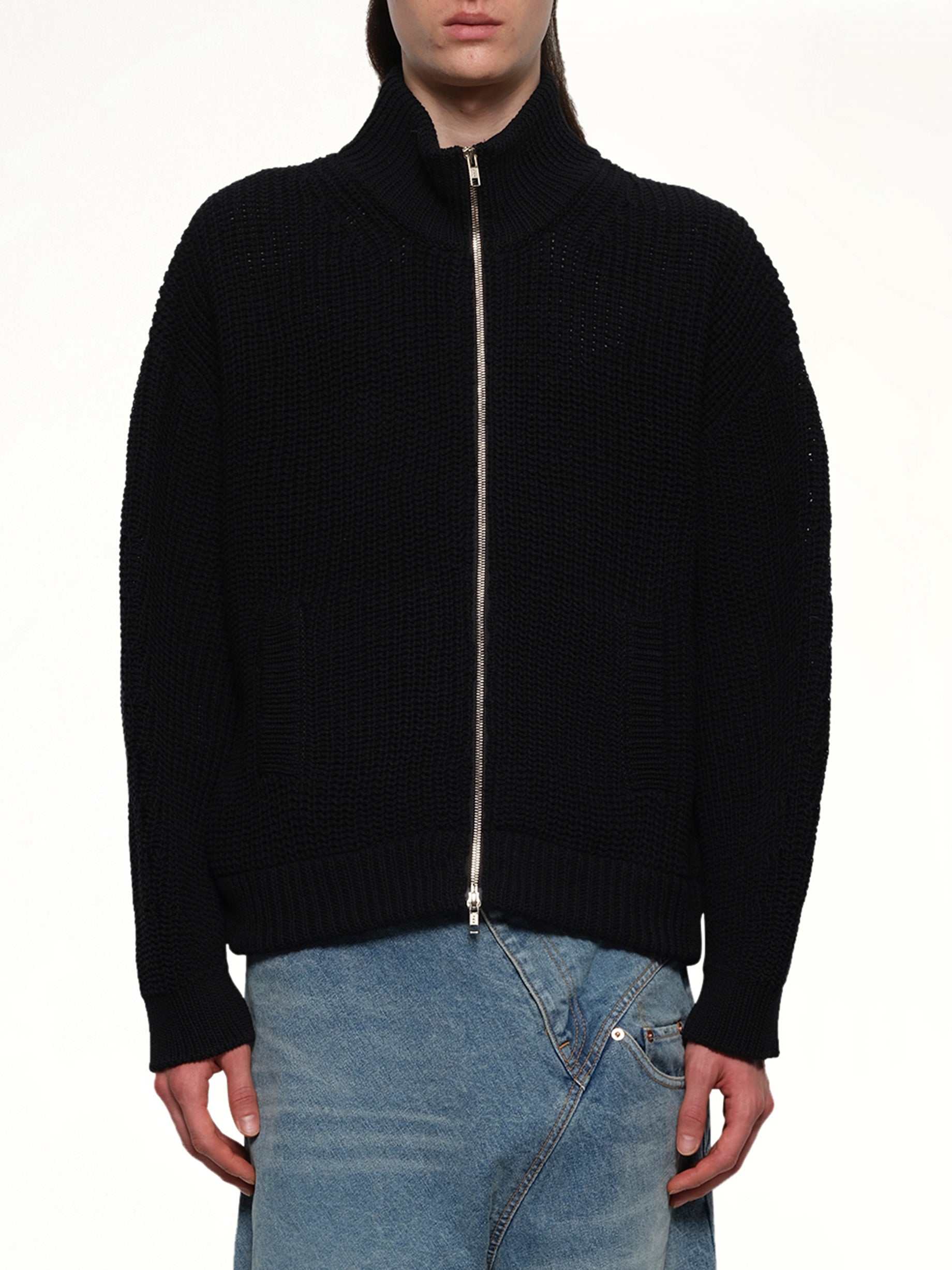 Image of a model wearing Tops. Productname: DOUBLET Bounce Fusion Drivers Knit in BLACK colour by brand - DOUBLET