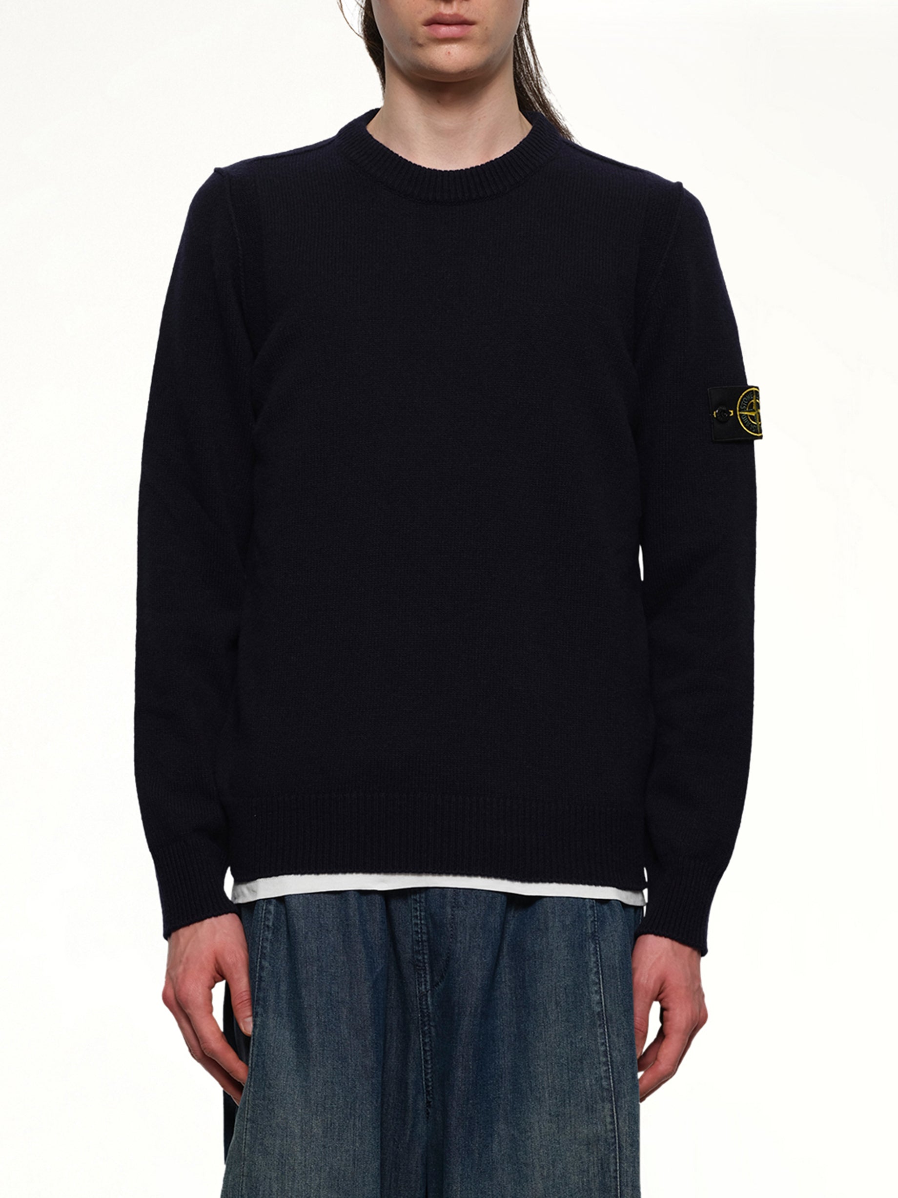 Image of a model wearing Outerwear. Product name - 510007 Crewneck Sweater in Navy colour by brand - STONE ISLAND