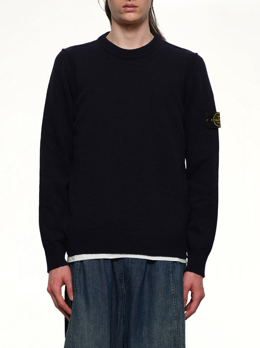 Image of a model wearing Outerwear. Product name - 510007 Crewneck Sweater in Navy colour by brand - STONE ISLAND