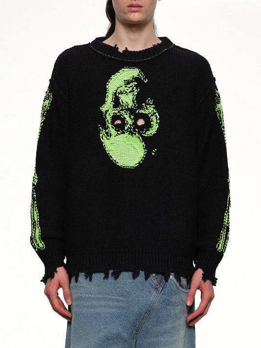 Image of a model wearing Outerwear. Productname: DOUBLET Glow-In-The-Dark Skull Knit Pullover in BLACK colour by brand - DOUBLET