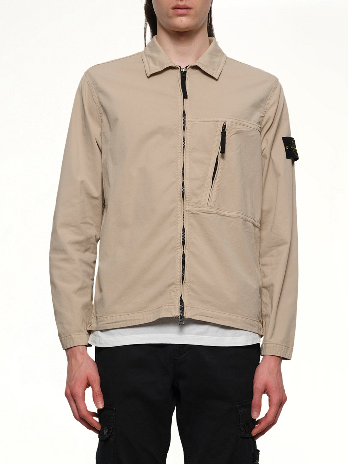 Image of a model wearing Tops. Product name - 120000 Supima Overshirt in Desert colour by brand - STONE ISLAND