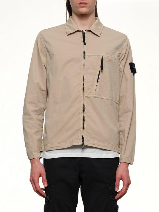 Image of a model wearing Tops. Product name - 120000 Supima Overshirt in Desert colour by brand - STONE ISLAND