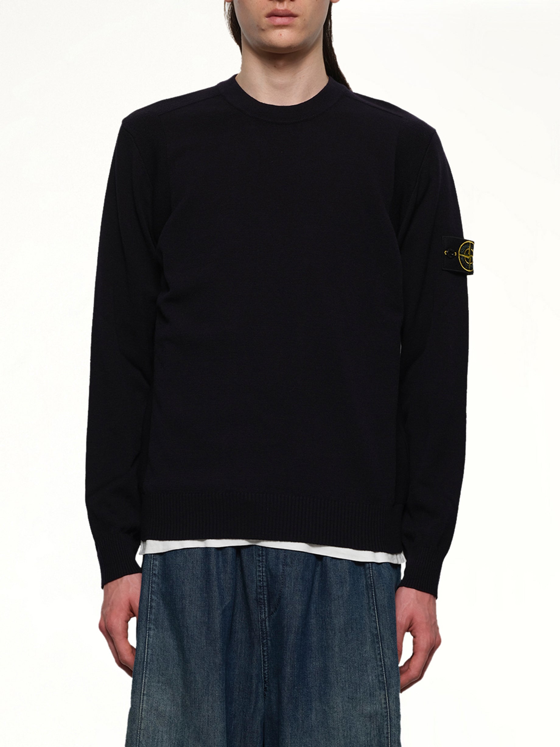 Image of a model wearing Outerwear. Product name - 5100001 Crewneck Sweatshirt in Navy colour by brand - STONE ISLAND