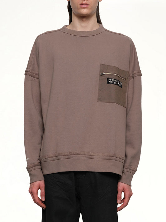 Image of a model wearing Outerwear. Productname: UNDERCOVER Pocket Sweatshirt in GRAY BEIGE colour by brand - UNDERCOVER