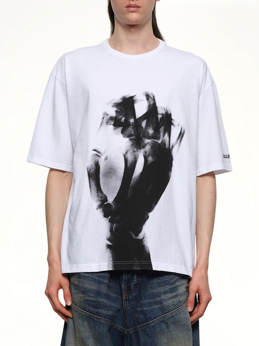 Image of a model wearing Tops. Productname: UNDERCOVER Faust T-Shirt in WHITE colour by brand - UNDERCOVER
