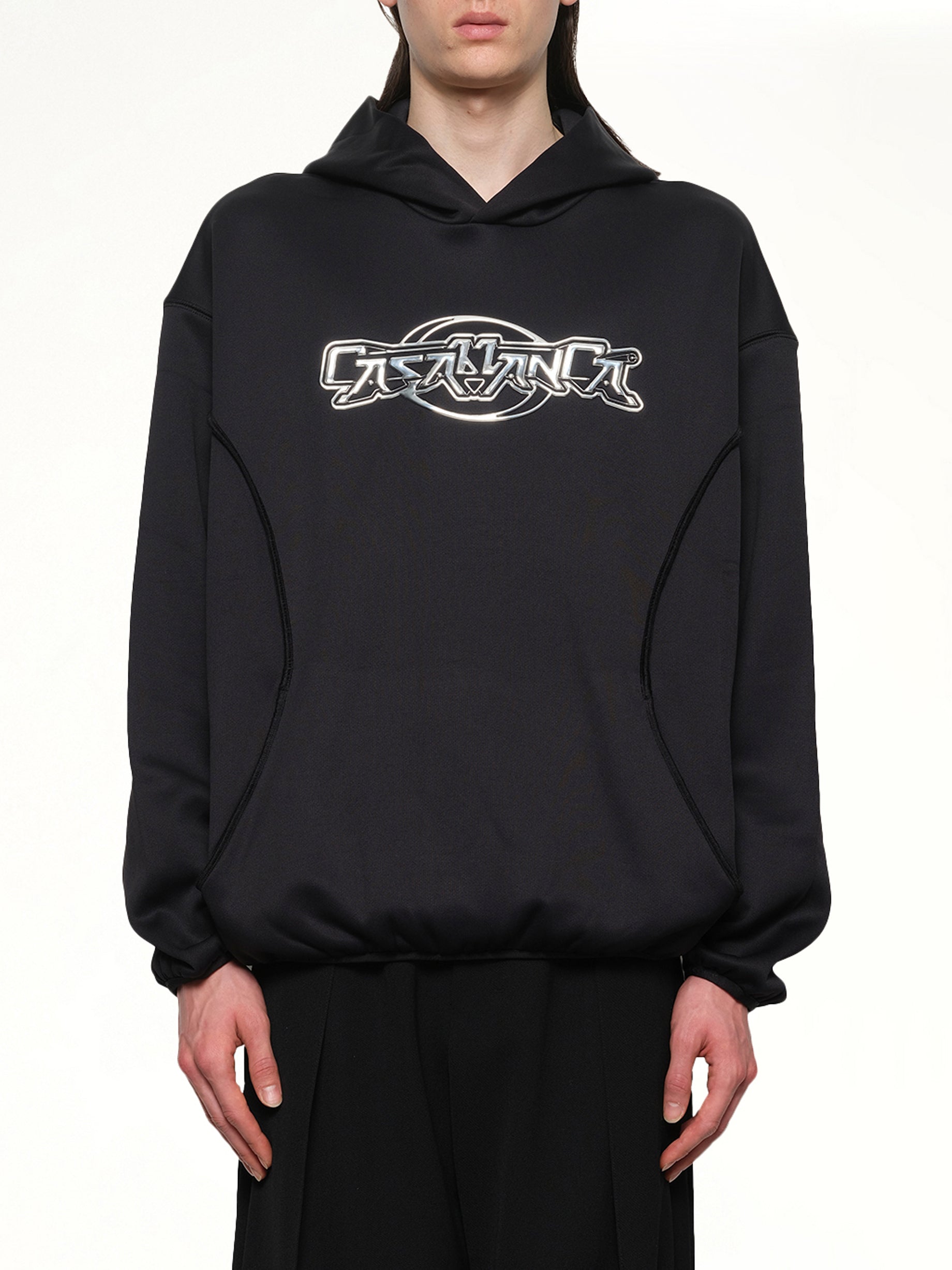 Image of a model wearing Outerwear. Productname: CASABLANCA Oversized Panelled Hoodie in BLACK colour by brand - CASABLANCA